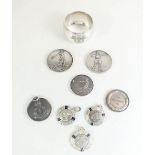 A selection of eight RAF 1950s/1960s white metal sporting medallions together with a plated napkin