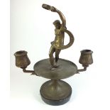 A 19th century bronze double candlestick with classical tambourine figure to centre - 26cm tall