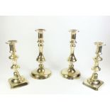 Two pairs of Victorian brass candlesticks