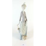 A large Lladro figure of a lady with umbrella 36cm tall