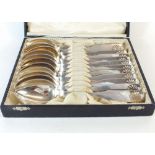 A set of David Andersen 830 standard silver dessert spoons with shell terminal, 480g