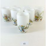 A set of six art glass beakers with striated colours on a white ground