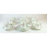 An Edwardian tea service printed rose buds comprising eight cups (four a/f) and eleven saucers, slop