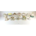 A collection of twelve Coalport porcelain cottage pastille burners