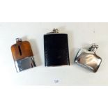A silver plated hip flask and two leather clad hip flasks