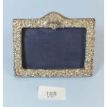 A silver rectangular small photograph frame with embossed decoration, 12 x 9cm