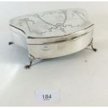 A large silver trinket box with engraved decoration and squat supports, Birmingham 1922