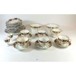 A Royal Staffordshire Edwardian tea service comprising five cups and saucers, eleven tea plates, two