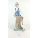 A Lladro figure goose girl