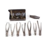 Seven various bullet molds, double ended shot flask, cleaning brushes, etc