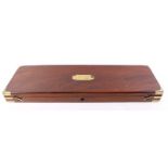 Mahogany gun case with brass name plate and corners, green baize lined fitted interior for