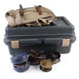 Canvas bag containing 1 brass and 3 other reels, green plastic Sportman's Utility case, one other