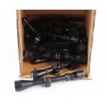 Ten various used rifle scopes and covers