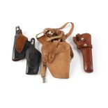 Four leather holsters,