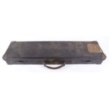 Leather gun case with brass corners, claret baize fitted interior for 28½ ins barrels, Leech &