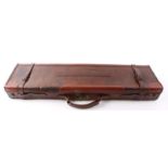 Leather gun case with reinforced leather corners, green baize lined interior for 30 ins barrels,