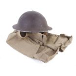 WWII British Tommy helmet with liner, and two canvas carriers with broad arrows, dated 1940 & 1943