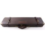 Oak and leather gun case with brass corners,