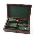Mahogany double pistol case with brass corners and inset vacant brass name plate, green baize
