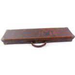 Red leather gun case, brass corners, red baize lined fitted interior,