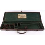 Leather gun case with green baize lined fitted interior for up to 30 ins barrels, mounted William