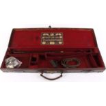 Leather gun case with brass corners, claret baize lined interior for 28½ ins barrels (will take 30
