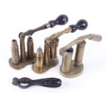 Three brass capper/decapper tools