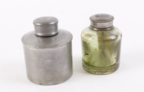 Glass oil bottle with white metal cap, the label reads 'Hillas's Exhibition Prize Oil sold by