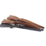 Two Remington 700 rifle stocks (black synthetic & wood), together with three other rifle stocks (5)