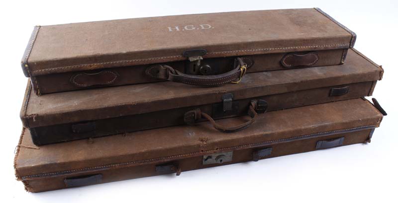 Canvas and leather gun case, stamped H.G.D, fitted interior for up to 27 ins barrels (a/f); canvas