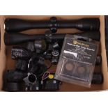 Four various rifle scopes and five pairs of scope rings