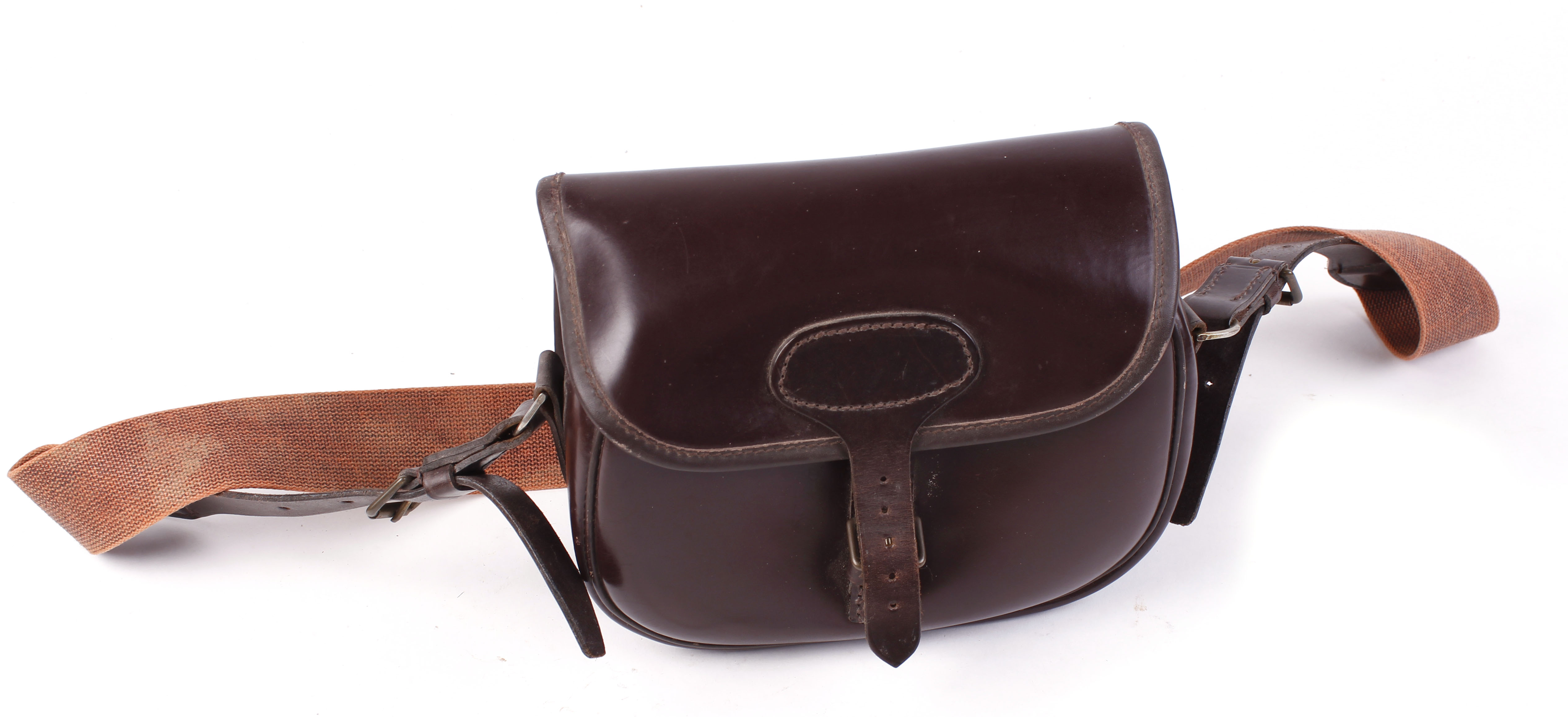 Brown leather cartridge bag, tan webbing strap
