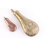 Copper and brass pistol flask with relief decoration; Brass powder flask with relief battle scene