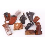 Eleven various ankle, spring clip, belt and other holsters