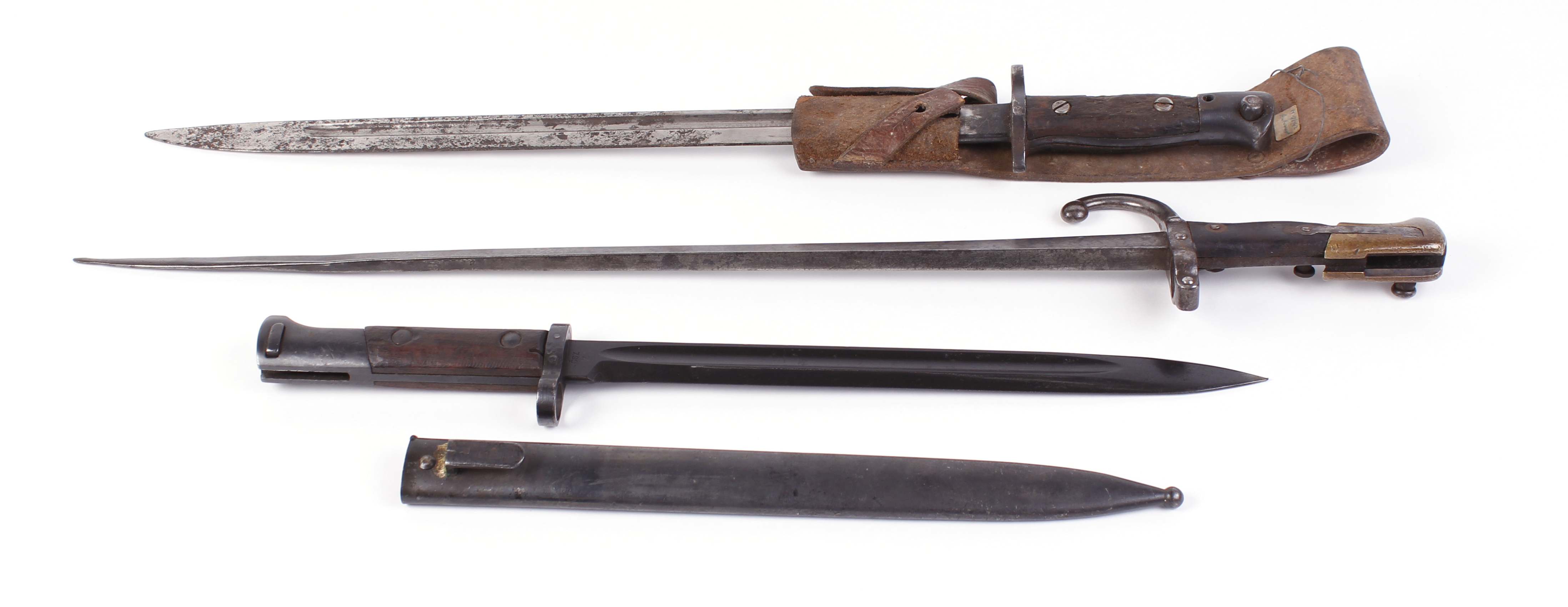 Enfield bayonet with leather frog, Mauser bayonet with scabbard, and another bayonet (3)