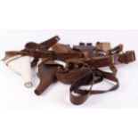 Three leather Sam Browne belts; five leather revolver holsters