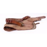 Two Brady leather 12 bore cartridge belts; Brady canvas and leather 45 ins gun slip