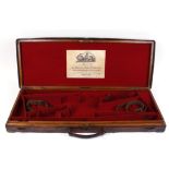 Oak and leather double motor case, red baize lined interior for 28/31 ins barrels, reproduction Boss
