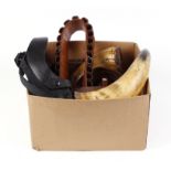 Bag containing leather belts, holsters, horns, etc