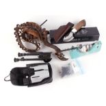 Box containing Puma hunting knife, binoculars, bipod with Harris adapter, powder scale, and two