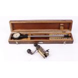 Cased vintage Mercer bore gauge; brass 12 bore pinfire roll turnover