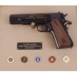 .45 Colt Government 'John Wayne Armed Forces' Commemorative edition semi automatic pistol, framed