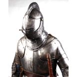 A full size replica suit of armour with ridge to helmet, sectional constructed pauldrons,