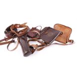 Three various leather cartridge bags; four leather cartridge belts; leather scope case