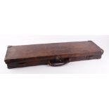 A good leather gun case with brass corners, red baize lined fitted interior for 30 ins barrels,