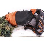Karrimor rucksack containing ghillie suit, camouflage net, repair lines, and walking stick
