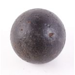 Early iron cannon ball, 6½ ins (approx) dia