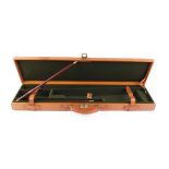 Pigskin covered gun case with green baize fitted interior for 30 ins barrels, with 2 piece