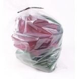 Bag containing green and red baize for lining