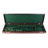 Mahogany gun case with brass corners, part fitted green baize lined interior with lined separators